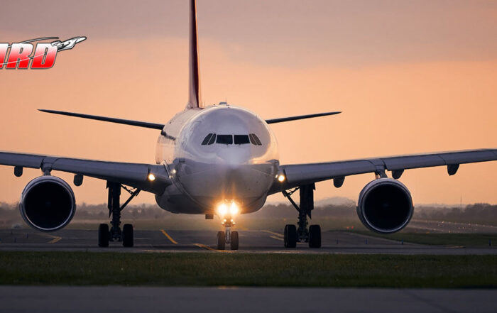 Airplane on the runway at sunset